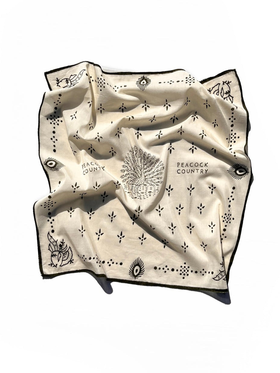 beige bandana with olive patterns on a white background