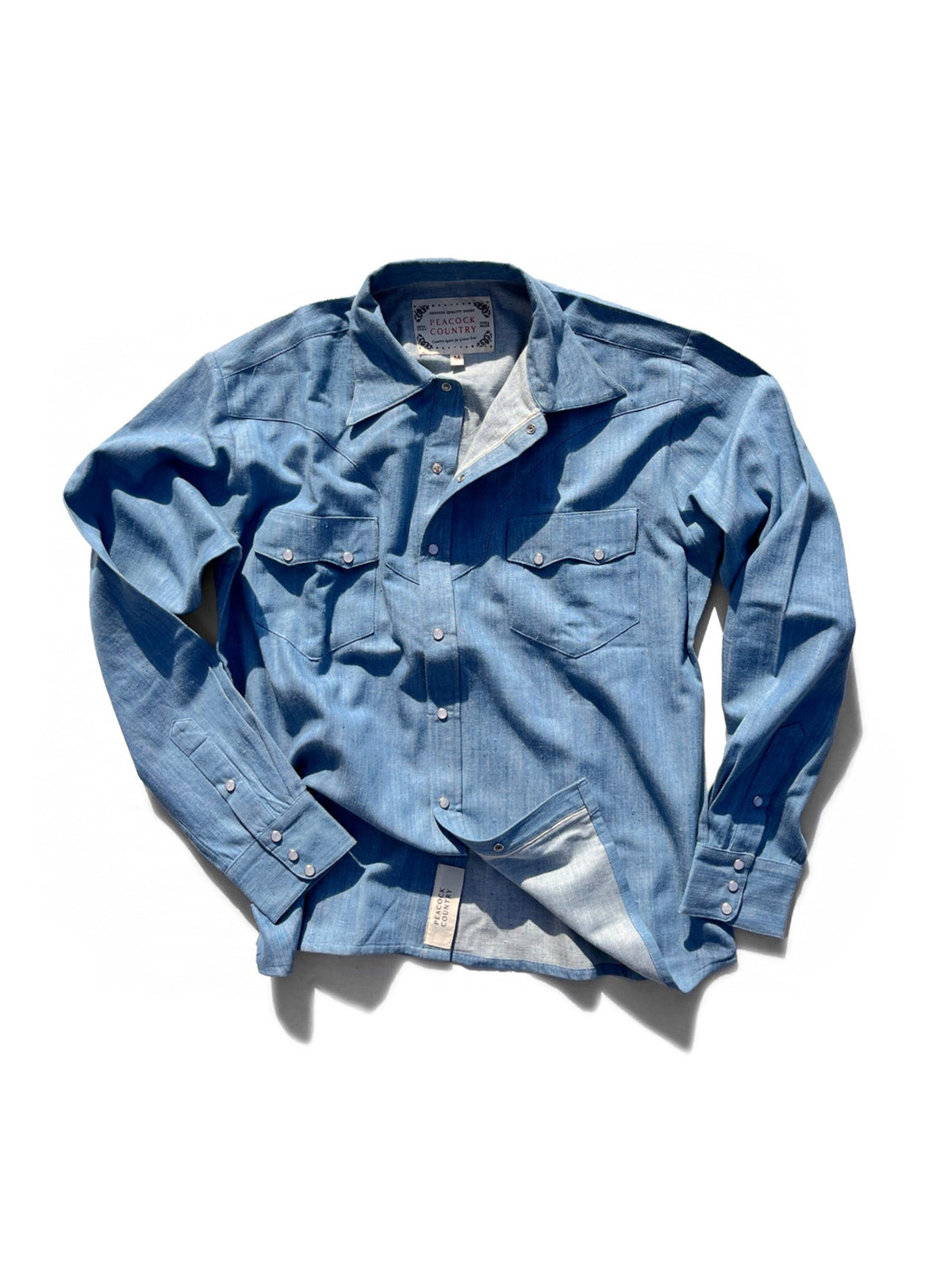 Blue denim shirt on a white background